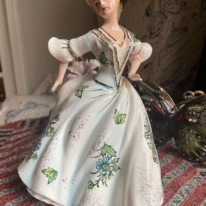 Elegant Porcelain Figurine with Floral Design porcelain planter